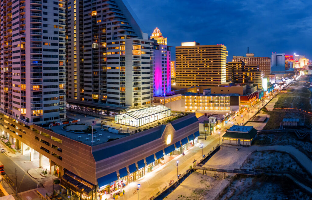 Aerial panorama of Atlantic city along the boardwalk at dusk.